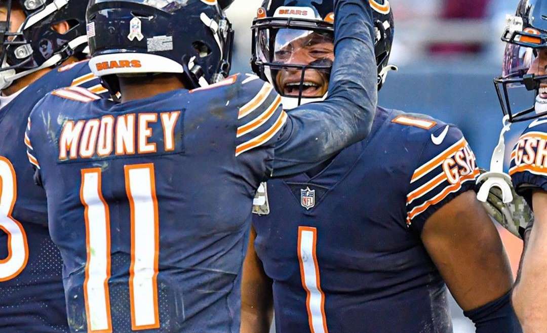 Chicago Sports Bromances blog post featured image of Justin Fields and Darnell Mooney celebrating during a game.